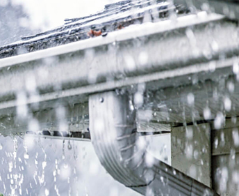 Rain falling on a gutter