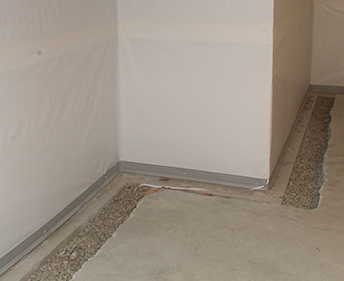 Interior  basement waterproofing barrier